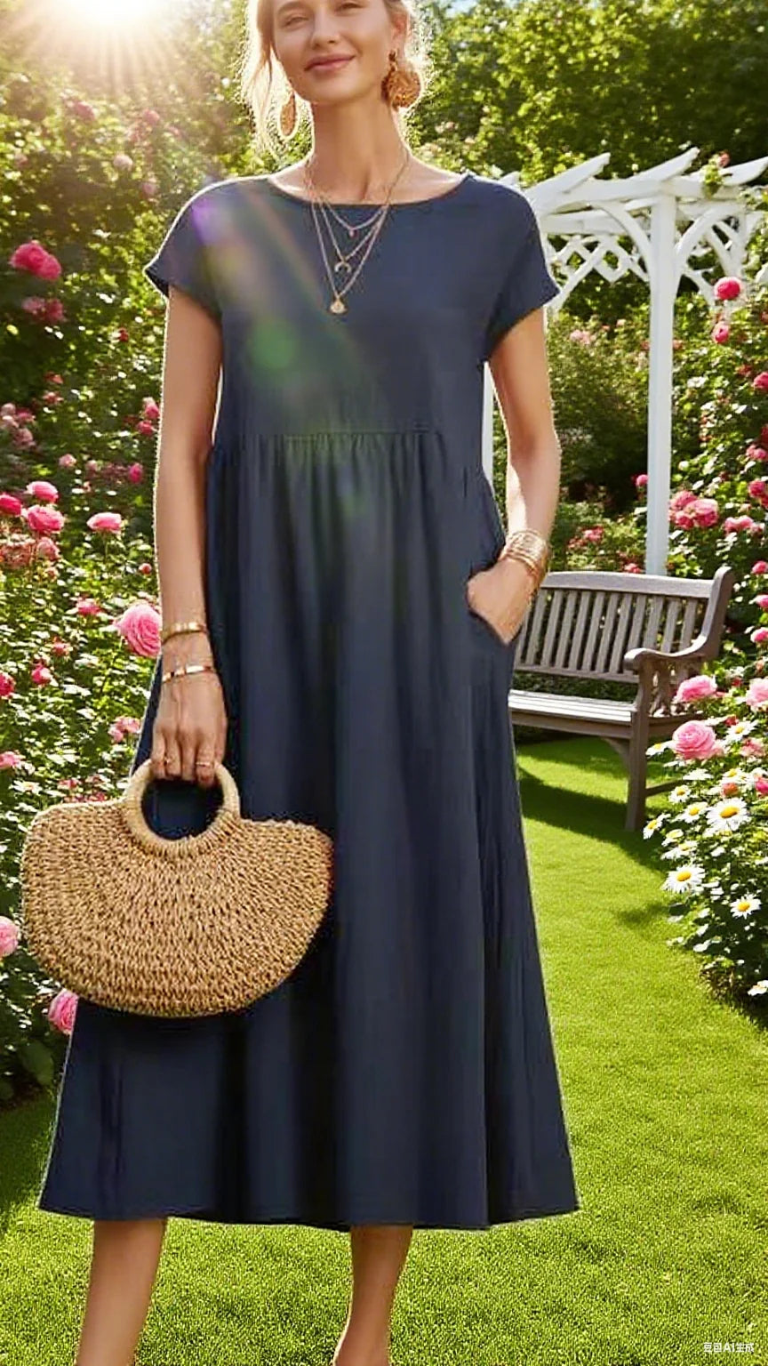 Short sleeved dress with neck design and natural pleats at the waist. The skirt is loose and drooping, and the fabric looks soft